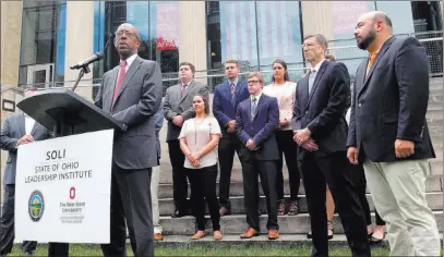  ?? Julie Carr Smyth ?? The Associated Press Ohio State University President Michael Drake, left, is joined Wednesday by Trevor Brown, center, dean of the John Glenn College of Public Affairs, and Ohio House Speaker Cliff Rosenberge­r to announce the launch of the Ohio...