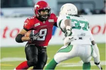  ?? Calgary Herald/files ?? Stamps Jon Cornish tries to get past Riders Rod Williams in the Western Final Nov. 17 in Calgary. The Riders won 35 to 13.