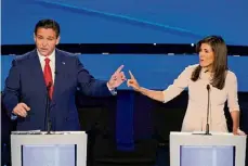  ?? ?? Andrew Harnik / Associated Press Former U.N. Ambassador Nikki Haley, right, and Florida Gov. Ron DeSantis point at each other during the CNN Republican presidenti­al debate at Drake University in Des Moines, Iowa, on Wednesday. As Republican primary voters prepare to cast ballots, leading candidates have all raised eyebrows with rhetoric on the Civil War and slavery.