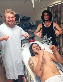  ??  ?? Jordan Haggart, left, Sabyn Wallace andTomJame­s celebrate their survival in hospital.