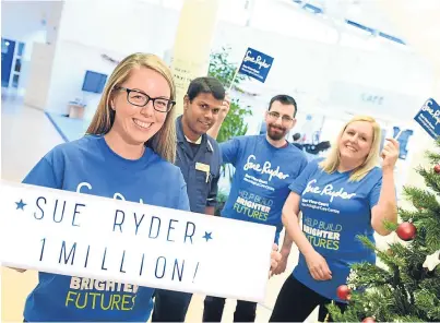  ?? Photograph by Kami Thomson ?? ON TARGET: From left, Lisa Glenday, Range Bandara, Matt Bakrowski and Michelle Allison of Sue Ryder Dee View Court, celebrate the successful fundraisin­g campaign.