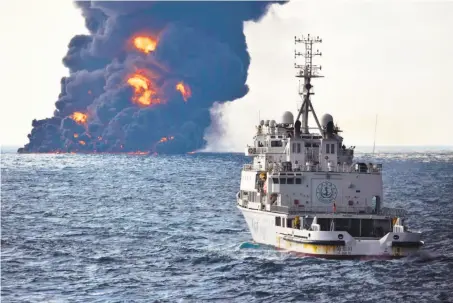  ?? China Ministry of Transport ?? A rescue ship sails near the burning Iranian oil tanker Sanchi on Sunday in the East China Sea. The tanker later sank.