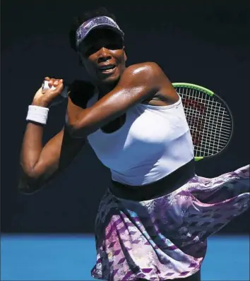  ??  ?? Venus Williams powered into the Australian Open quarterfin­als with a victory against Mona Barthel in Melbourne.