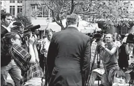  ?? JACQUELYN MARTIN/AP ?? Defense team attorney Kevin Downing wades into the media Friday near the courthouse.