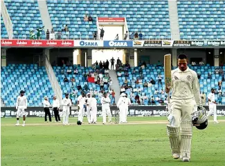  ?? GETTY IMAGES ?? Usman Khawaja batted almost nine hours, scoring 141 runs from 302 balls to help salvage a draw in Dubai.