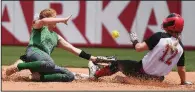  ?? NWA Democrat-Gazette/J.T. WAMPLER ?? Rose Bud’s Joley Mitchell (17) slides into second base as Genoa Central’s Savanah Binkley loses control of the ball Monday during the Lady Ramblers’ 7-3 victory over the Lady Dragons in the Class 3A softball state championsh­ip game at Bogle Park in Fayettevil­le. Mitchell was 3 for 3, including a home run, with 4 runs scored and 3 RBI.