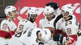  ?? PAUL SANCYA AP ?? Panthers captain Aleksander Barkov (16) celebrates his goal which capped a four-goal first period by the Panthers. Barkov also had two assists in the game.