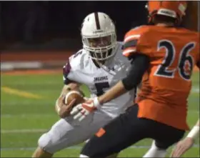  ?? PETE BANNAN — DIGITAL FIRST MEDIA ?? Garnet Valley running back Danny Bradley tries to cut past the defense of Marple Newtown’s Cameron Leone Friday.