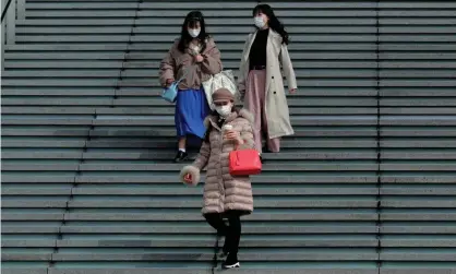  ??  ?? Women wearing face masks in Osaka. Japan said last month that a patient had had the virus twice. Photograph: Buddhika Weerasingh­e/ Getty Images