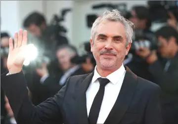  ?? — Reuters file photo ?? Director Cuaron arrives for a screening of the film ‘Roma’ at the 75th Venice Internatio­nal Film Festival in Venice, Italy, in August.