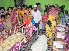  ?? AFP ?? Bangladesh­i relatives surround the bodies of some of those killed in a stampede at a charity distributi­on event in Mymensingh yesterday.