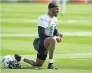  ?? MARTA LAVANDIER/AP ?? Dolphins wide receiver Cedrick Wilson Jr. takes part in drills at the team’s practice facility in 2022 in Miami Gardens.