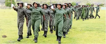  ?? MACLENNAN Picture: SUE ?? FUTURE GUARDIANS: Graduates from a field ranger cadet pilot project are put through their paces at a passing-out parade at PJ Olivier High School in Makhanda on Sunday