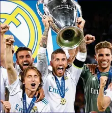  ?? GETTY IMAGES ?? Wide-eyed: Ramos lifts the cup again