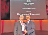  ??  ?? Alisdair Barnett receives the award at Kia conference in Liverpool from Paul Philpott, president and chief executive of Kia Motors (UK) Ltd