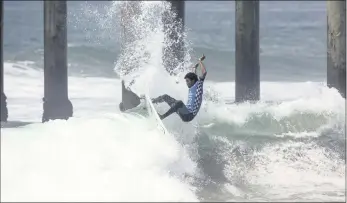  ??  ?? CHECK THIS OUT: Michael February shows the form that has carried him into the last 24 in the US Open of Surfing.