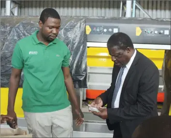  ??  ?? Industry, Commerce and Enterprise Developmen­t Minister Mike Bimha and PHD Ministries leader Prophet Walter Magaya discuss during the assessment tour of Yadah Marble factory plant in Southerton, Harare, yesterday.
(Picture by Innocent Makawa)