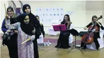  ?? Ravindrana­th K / The National ?? Composer Eman Al Hashimi and volunteers at a workshop for autistic children at the New England Centre.
