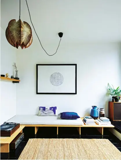  ??  ?? The living area Tilly Hemingway’s partner, Dan, made the daybed. The mattress and rug are from Ikea (ikea.com). The patterned cushion is by Laura Slater (laura slater.co.uk). The large vases are West German; Hemingway picks them up at places like...