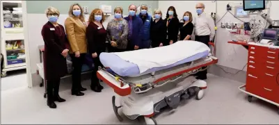  ?? Special to The Herald ?? Generous local couple Pat and Herb Wycherley (middle) are surrounded by directors and staff from the South Okanagan Similkamee­n Medical Foundation during the unveiling of an updated trauma bay at South Okanagan General Hospital.