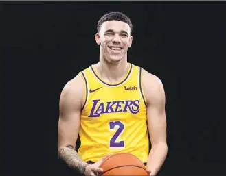  ??  ?? LONZO BALL IS COMING OFF a rookie season in which he missed 30 games because of injuries, and this season he probably will have Rajon Rondo starting in front of him.