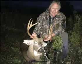  ??  ?? John Dick shows his trophy buck taken early in the bow season.