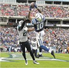  ?? Andy Lyons / Getty Images ?? Donte Moncrief comes down with an Andrew Luck pass in the fourth quarter for Luck’s second touchdown in 56 seconds.