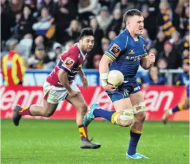  ?? PHOTO: LINDA ROBERTSON ?? You can’t catch me . . . Otago’s Dylan Nel runs away from Southland’s Moses Faletolu to score during the Ranfurly Shield match at Forsyth Barr Stadium in Dunedin on Saturday.
