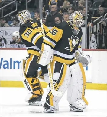  ?? Peter Diana/Post-Gazette ?? Tristan Jarry, right, replaces Matt Murray in the second period Saturday. Murray allowed three goals on 13 shots in just under 24 minutes.