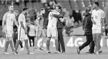  ??  ?? This file photo taken on Oct 05 shows England’s manager Gareth Southgate (right) embraces England’s striker Harry Kane (left) after the final whistle during the FIFA World Cup 2018 qualificat­ion football match between England and Slovenia at Wembley...