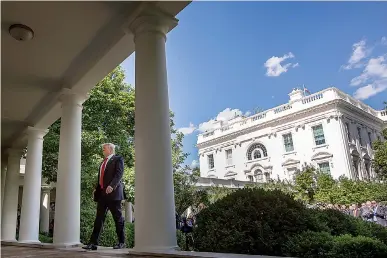  ?? AP Photo/Andrew Harnik ?? President Donald Trump walks to the Oval Office of the White House on Thursday in Washington after speaking in the Rose Garden about the U.S. role in the Paris climate change accord.