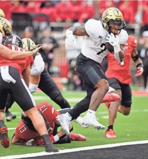  ?? ?? UCF running back RJ Harvey scores a touchdown against Texas Tech on Nov. 18 at Jones AT&T Stadium.