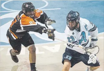  ?? JULIE JOCSAK THE ST. CATHARINES STANDARD ?? Six Nations’ Tyler Fox-MacKenzie (81) defends against St. Catharines’ Alex Tamas (23) in Jr. A lacrosse playoff action Wednesday night at Jack Gatecliff Arena in St. Catharines.