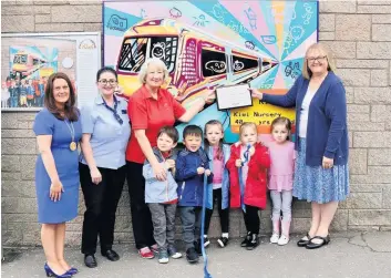  ??  ?? Community links Depute provost Collette Stevenson with Doris, Arlette and children from Kiwi Playgroup for plaque unveiling at East Kilbride railway station