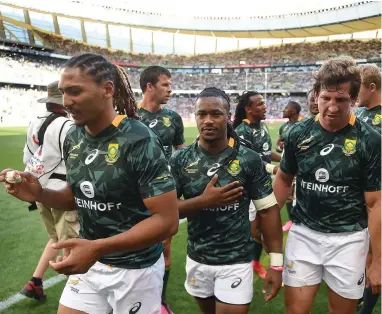  ??  ?? WE ARE SORRY, CAPE TOWN: Blitzboks players Justin Geduld, Branco du Preez and Kwagga Smith after losing 12-19 to New Zealand in the semi-final at Cape Town Stadium.