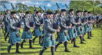  ??  ?? Pipe Major Stuart Liddell leads Inveraray and District Pipe Band to British Championsh­ip success. Photo by Alister Sinclair