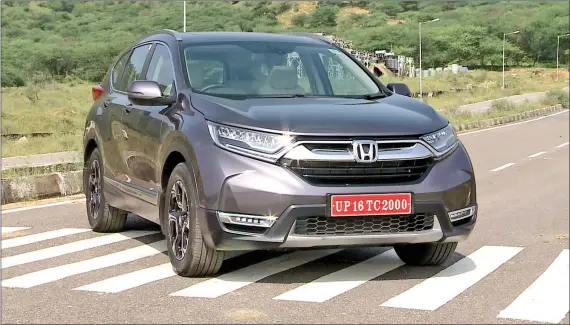  ??  ?? The grille on the fifth generation CR-V looks very Honda, and the thick chrome bar adds to the muscle.