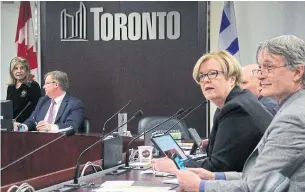  ?? DAVID RIDER TORONTO STAR ?? Couns. Shelley Carroll and Gord Perks, right, with budget chief Gary Crawford, left, ask staff questions during the launch of the 2020 city budget deliberati­ons on Friday.