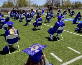  ?? Matthew Jonas, Daily Camera file ?? Graduates sit socially distanced during commenceme­nt ceremonies for Front Range Community College on its Boulder County campus in Longmont on May 13.