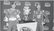  ?? JERRY MARKLAND/GETTY IMAGES ?? Kevin Harvick (left) and Kurt Busch pose with the Sprint Cup Trophy after making the Chase for the Sprint Cup.