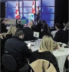  ?? DAVID LEA METROLAND ?? Robert Hogue, assistant chief economist with RBC, delivers the 2024 economic outlook at an Oakville Chamber of Commerce event on Tuesday.