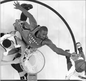  ?? MARCIO JOSE SANCHEZ/THE ASSOCIATED PRESS ?? Oklahoma City Thunder big man Serge Ibaka (9) battles for a rebound with Golden State Warriors forward Harrison Barnes, bottom right, during Game 1 of the best-of-7 Western Conference finals in Oakland, Calif., on May 16. In the first two games of the...