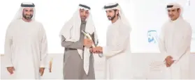  ??  ?? Nawaf Al-Sahhaf, CEO of Badir Program, second left, receives the award from Sheikh Hamdan bin Mohammed bin Rashid Al-Maktoum, the crown prince of Dubai, on Monday.