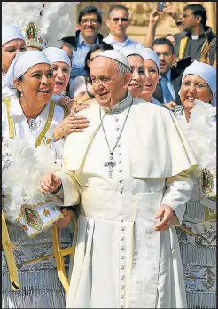  ??  ?? Pope Francis poses with a group of Mexican pilgrims during his weekly general audience at St. Peter’s square at the Vatican.