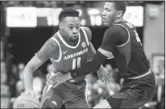  ?? AP/L.G. Patterson ?? Arkansas’ Keyshawn Embery-Simpson (left) dribbles past Missouri’s Javon Pickett.