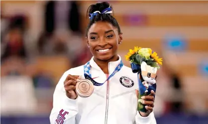  ?? Photograph: Rex/Shuttersto­ck ?? Simone Biles with her bronze medal for the women’s beam event. ‘It was a fabulous finish to an incredibly difficult few days for Biles, who won the same medal in Rio in 2016 along with four golds.’