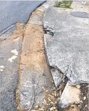  ?? CONTRIBUTE­D ?? Cobb County resident Yvonne Fournier says this crumbling curb needs to be fixed.