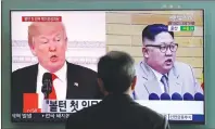  ?? AP PHOTO ?? In this March 27, 2018 photo, a man watches a TV screen showing file footages of U.S. President Donald Trump, left, and North Korean leader Kim Jong Un, right, during a news program at the Seoul Railway Station in Seoul, South Korea.