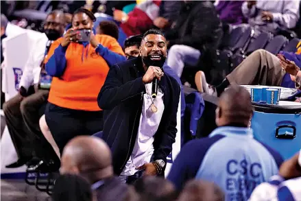  ?? AP Photo/Julio Cortez ?? ■ Singer Ginuwine performs during halftime of the CIAA women’s championsh­ip NCAA college basketball game between Lincoln University and Elizabeth City State University on Feb. 26 in Baltimore.