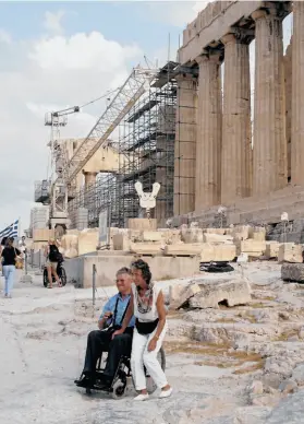  ?? Rick Steves ?? It doesn’t have to be new to be accessible. Visitors who can’t use stairs can reach the top of the Acropolis in Athens via elevator, and that’s true of plenty of popular tourist sites.